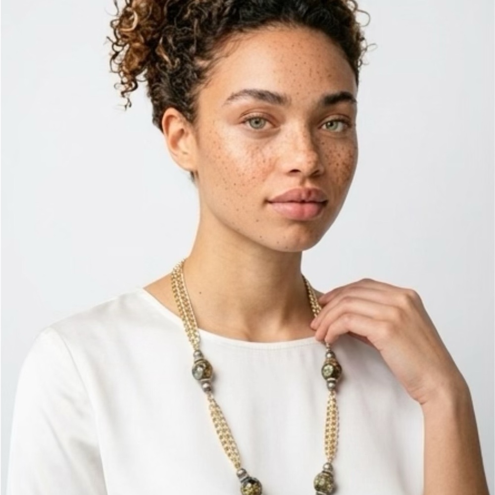 Gold Beaded Long Necklace with Decorative Accents